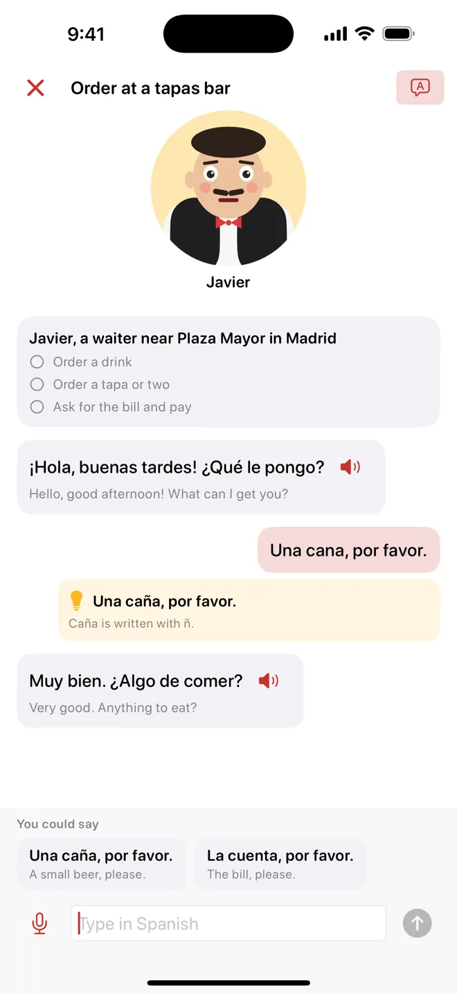 A conversation with Javier, a cartoon waiter at a tapas bar, with a correction of the learner's line and his reply with its translation